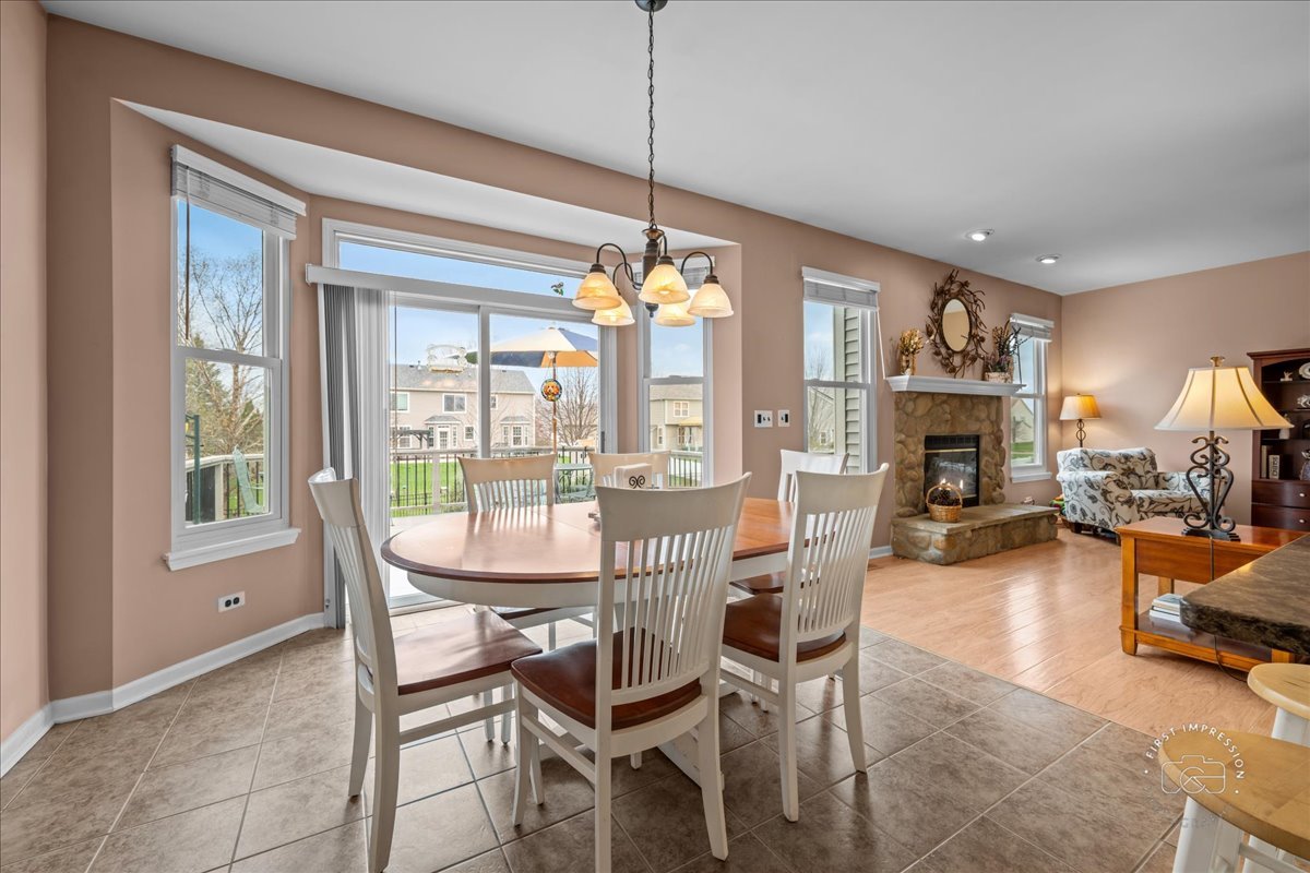 2519 Imgrund Road North Aurora, IL 60542 - Photo 13 of 33 a dining room with furniture window wooden floor