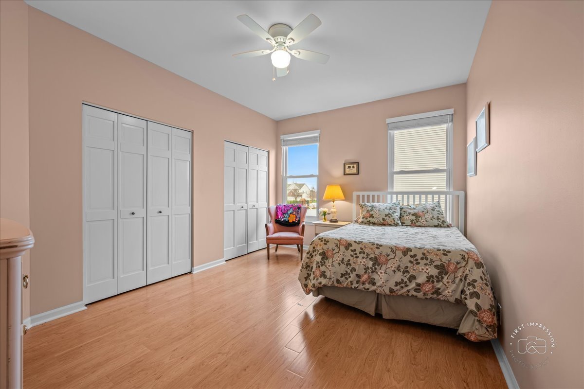 2519 Imgrund Road North Aurora, IL 60542 - Photo 18 of 33 a bedroom with a bed and a chandelier