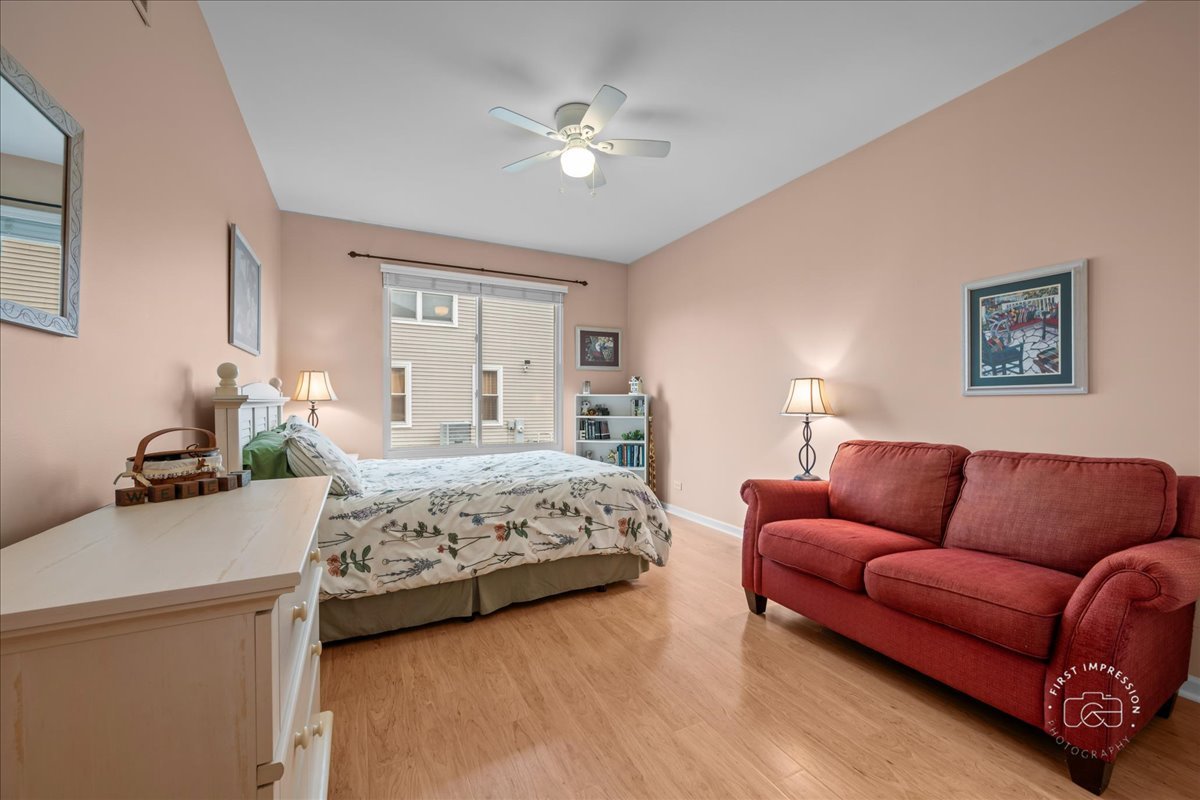 2519 Imgrund Road North Aurora, IL 60542 - Photo 19 of 33 a bedroom with a bed couch and window