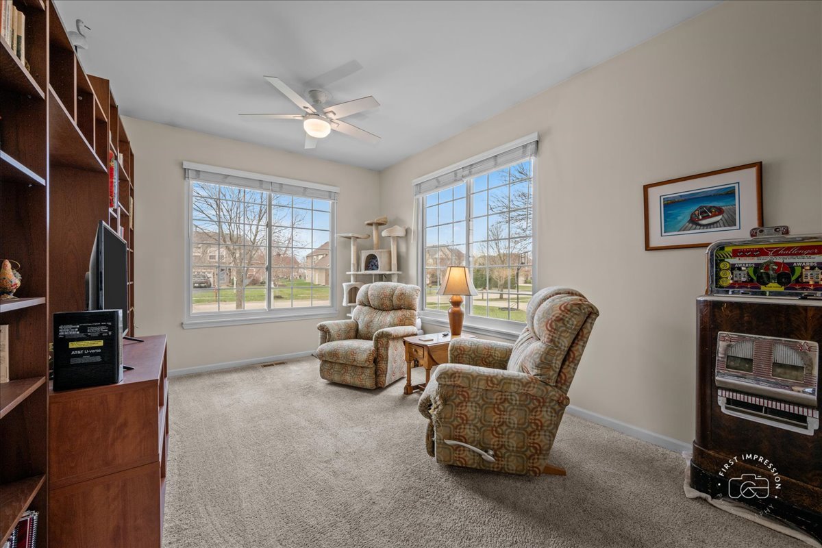 2519 Imgrund Road North Aurora, IL 60542 - Photo 21 of 33 a living room with furniture and a flat screen tv