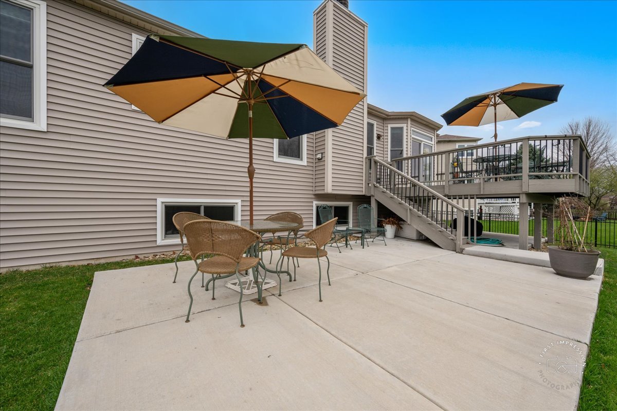 2519 Imgrund Road North Aurora, IL 60542 - Photo 29 of 33 a view of a patio with a table and chairs under an umbrella