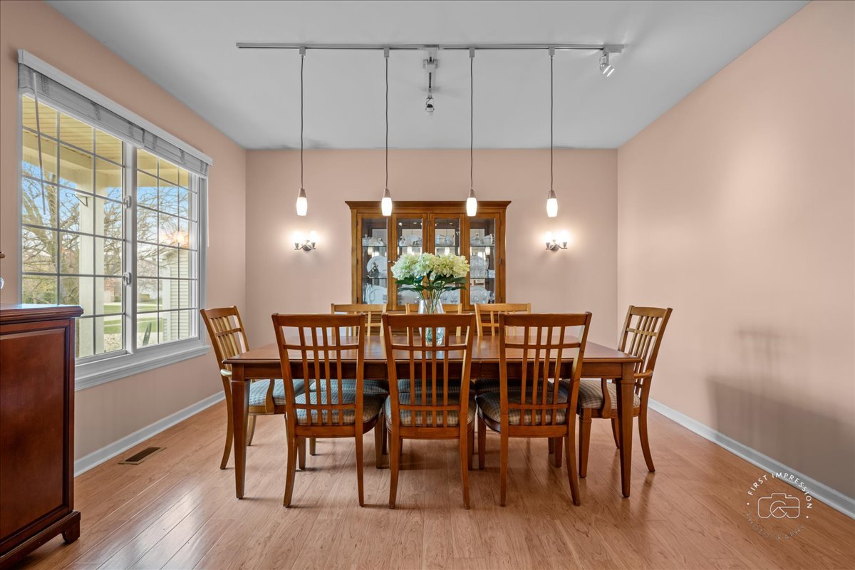 2519 Imgrund Road North Aurora, IL 60542 - Photo 4 of 33 a view of a dining room with furniture window and wooden floor
