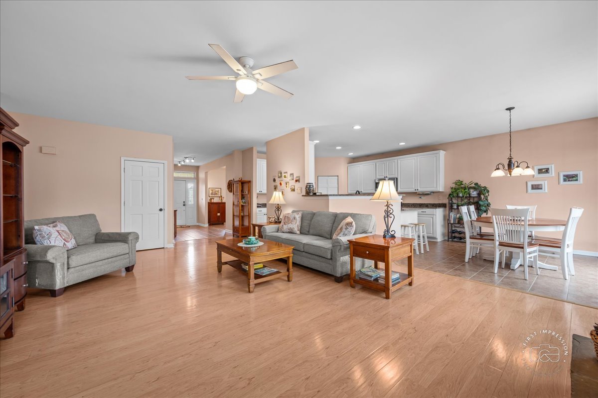 2519 Imgrund Road North Aurora, IL 60542 - Photo 8 of 33 a living room with furniture kitchen view and a chandelier