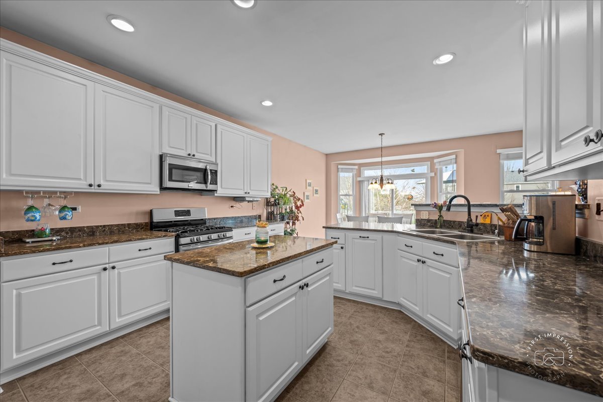 2519 Imgrund Road North Aurora, IL 60542 - Photo 10 of 33 a kitchen with sink stove and cabinets