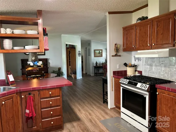a kitchen with stainless steel appliances a stove and a refrigerator