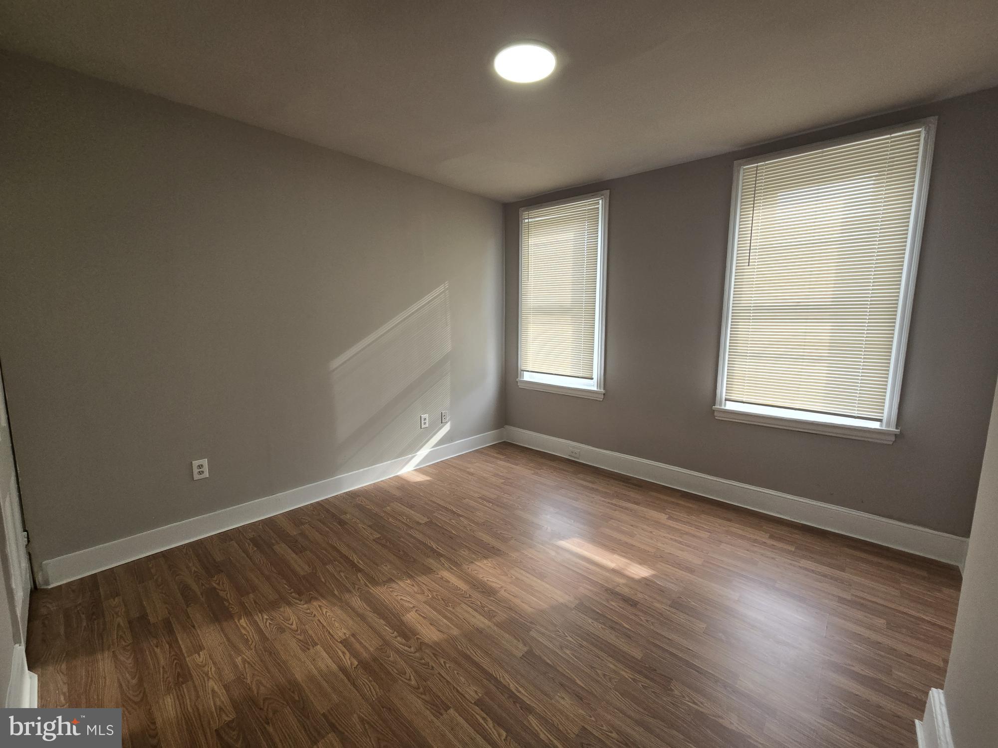6138 North Lambert Street Philadelphia, PA 19138 - Photo 16 of 25 an empty room with wooden floor and windows