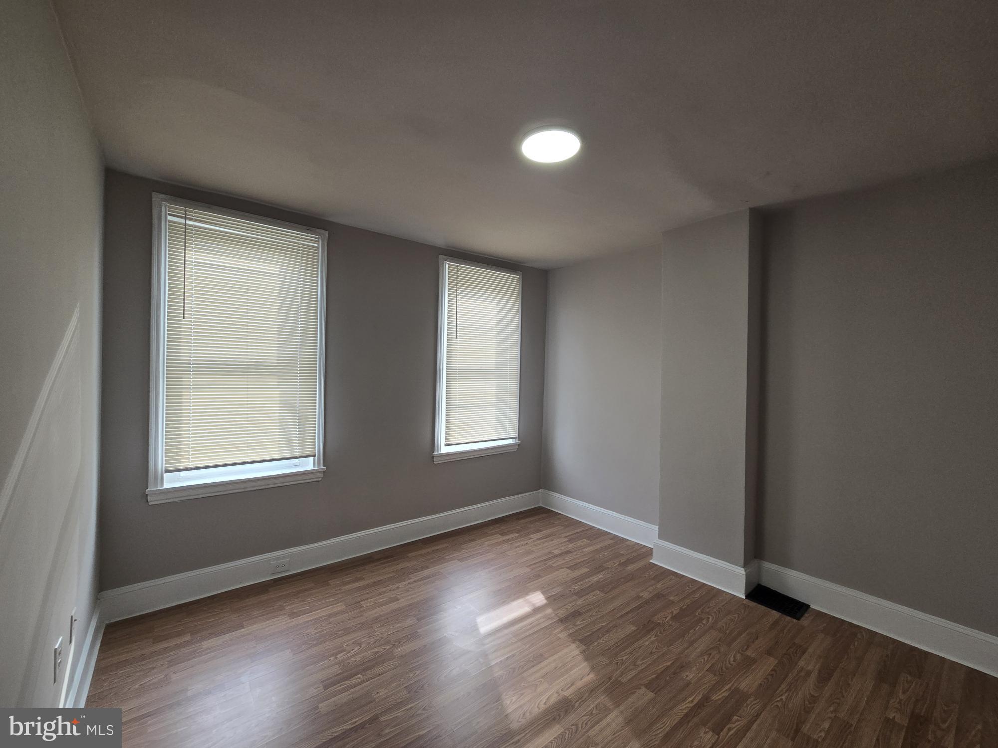 6138 North Lambert Street Philadelphia, PA 19138 - Photo 17 of 25 an empty room with wooden floor and windows