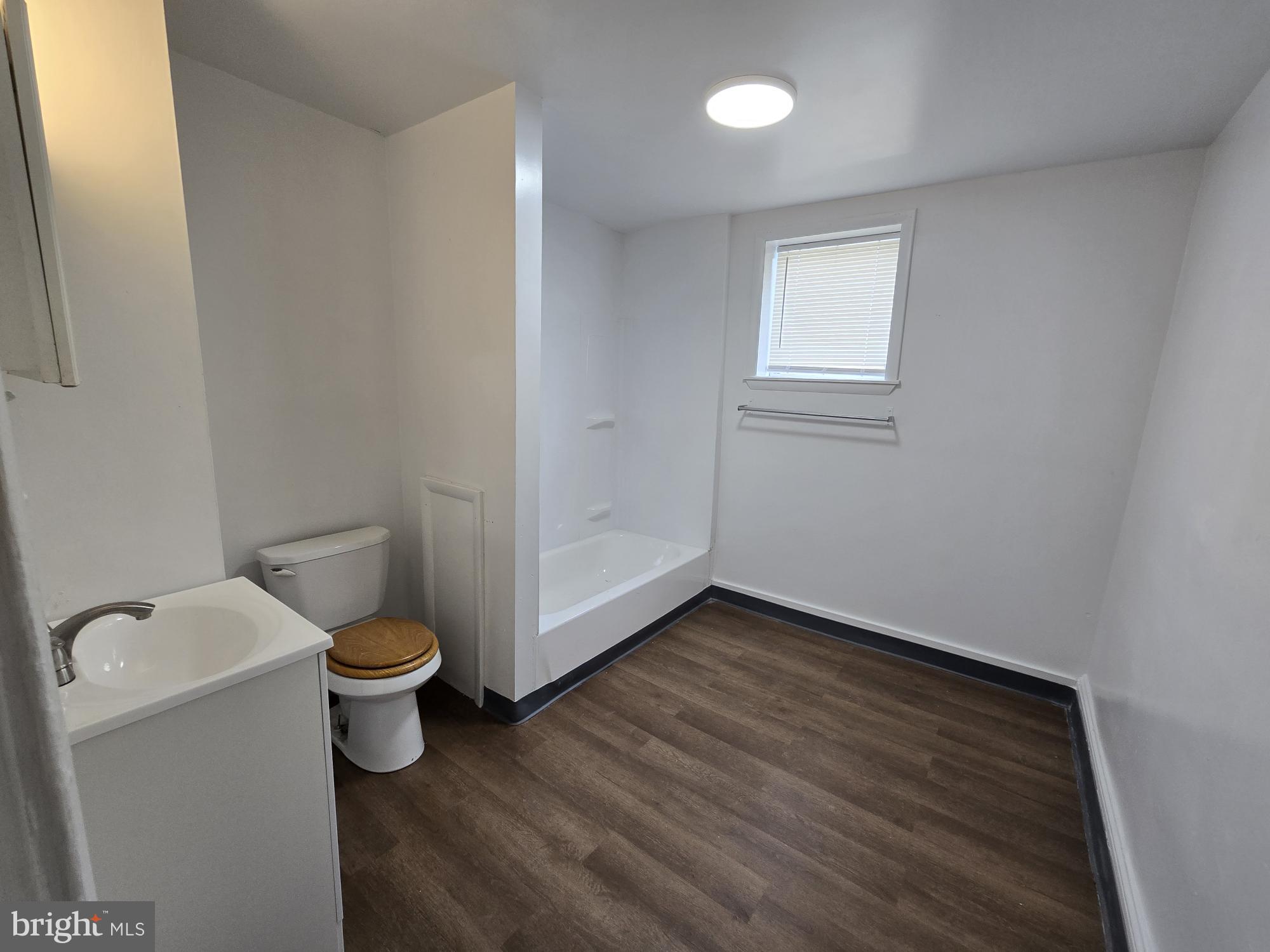 6138 North Lambert Street Philadelphia, PA 19138 - Photo 19 of 25 a bathroom with a toilet a sink and a vanity
