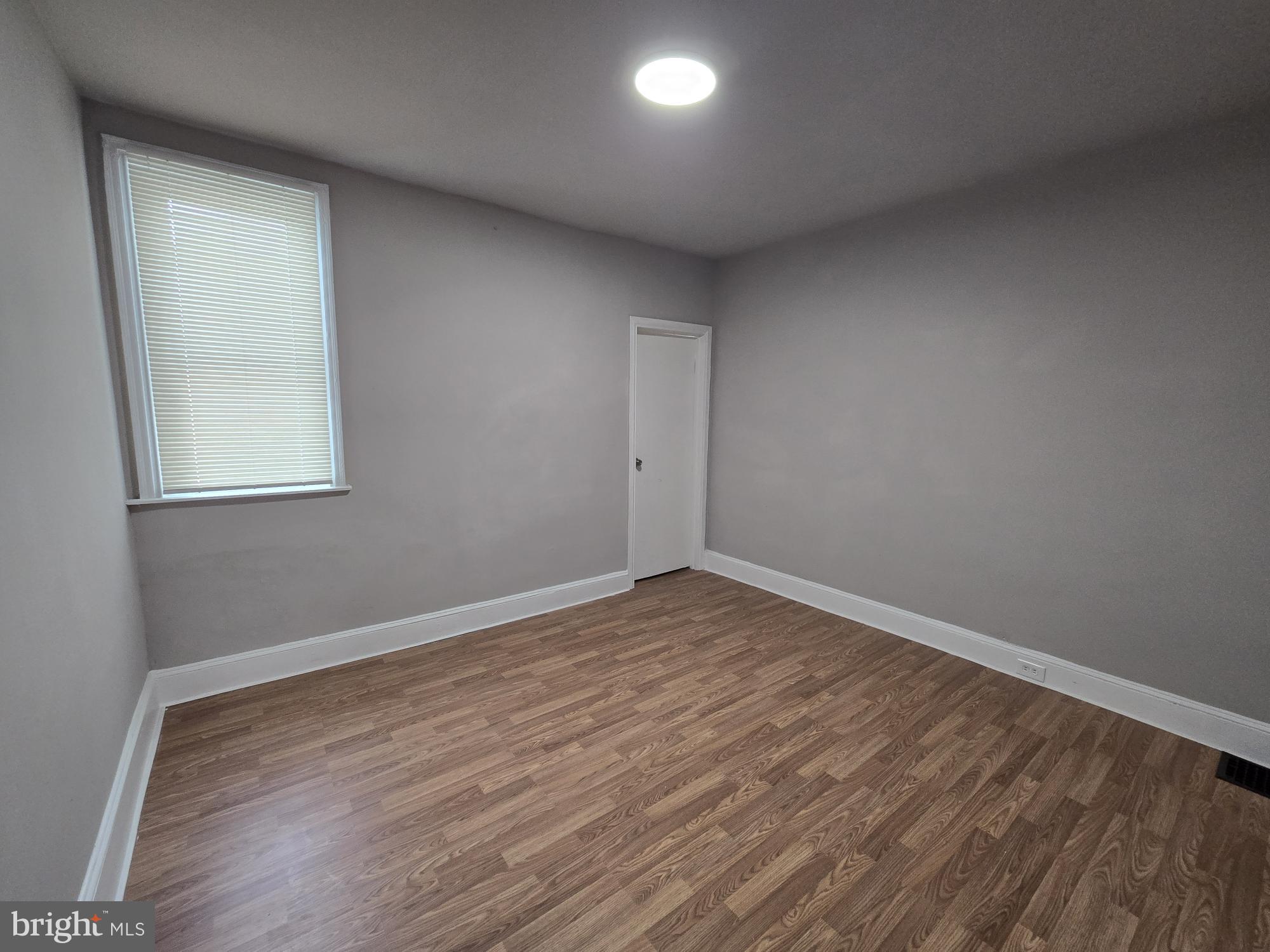 6138 North Lambert Street Philadelphia, PA 19138 - Photo 22 of 25 an empty room with wooden floor and windows