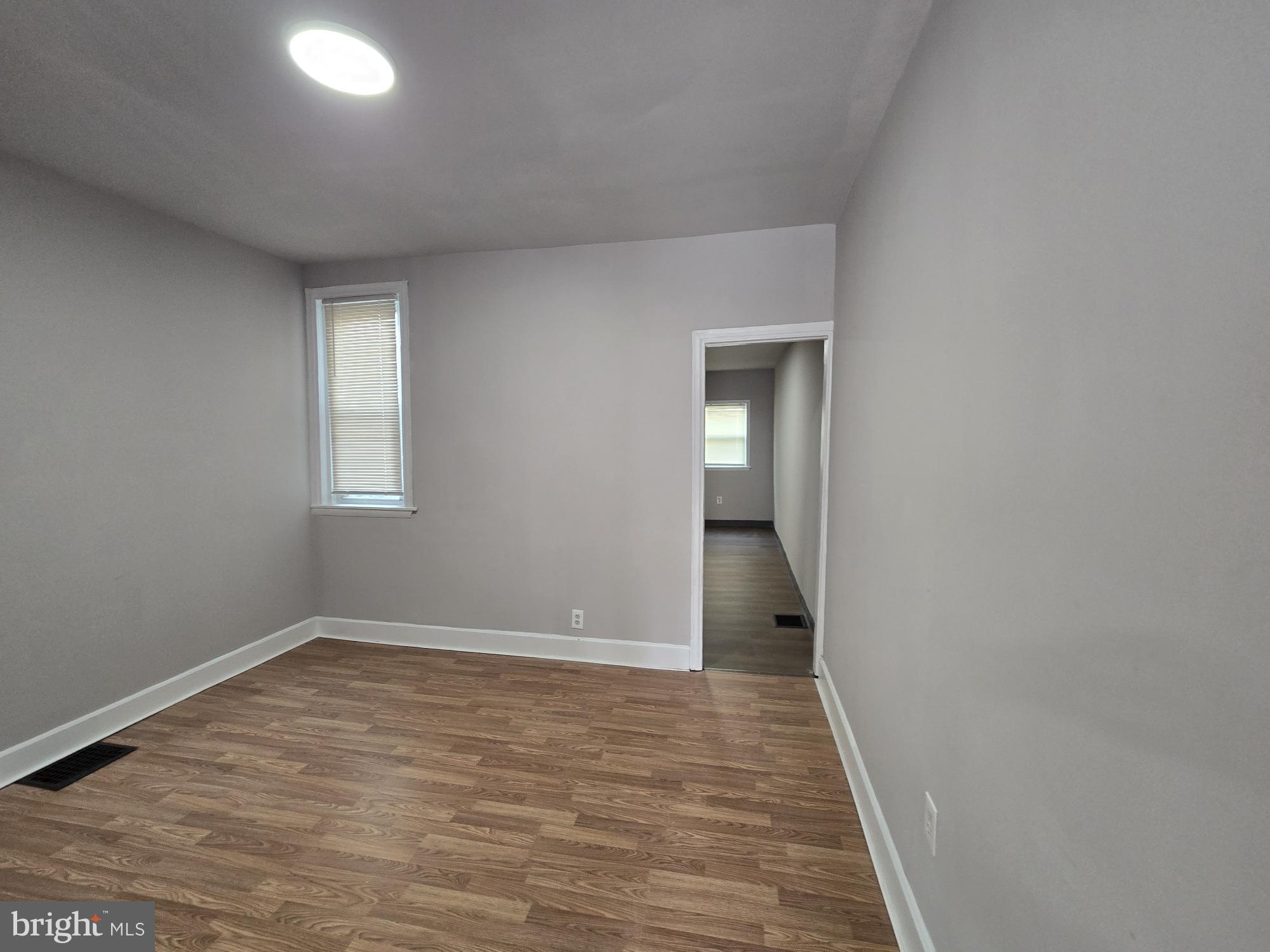 6138 North Lambert Street Philadelphia, PA 19138 - Photo 6 of 25 wooden floor in an empty room with a window