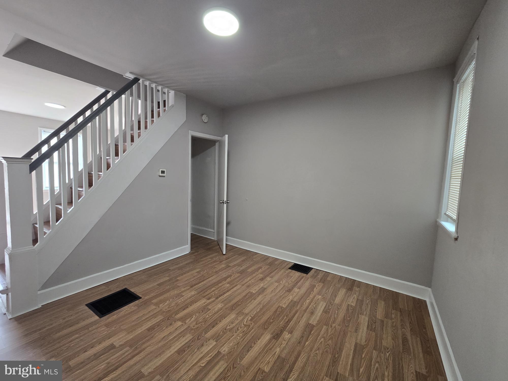 6138 North Lambert Street Philadelphia, PA 19138 - Photo 7 of 25 a view of room with stairs and wooden floor