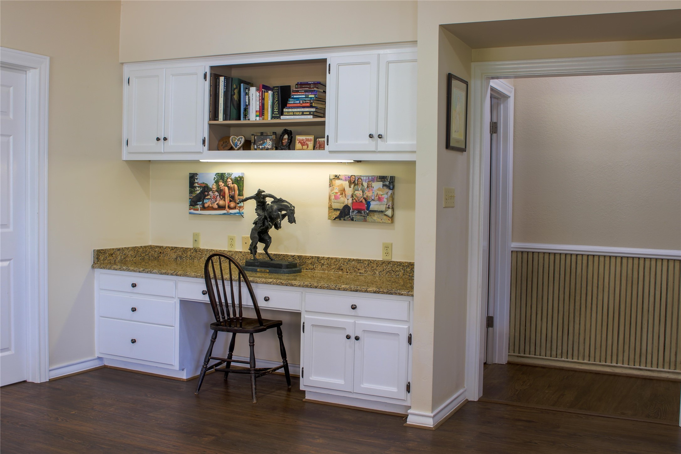 405 Frederick Road Fredericksburg, TX 78624 - Photo 11 of 29 A dedicated home office space features built-in cabinetry, providing ample storage and a functional workspace.