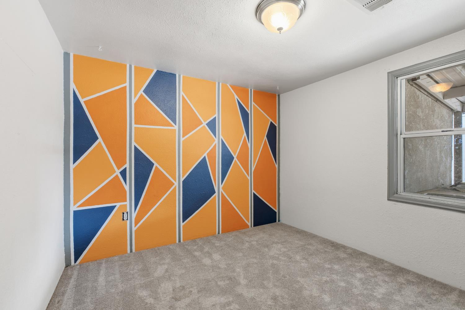 638 Orange Avenue Ripon, CA 95366 - Photo 13 of 30 an ocean room with stairs and a ceiling fan