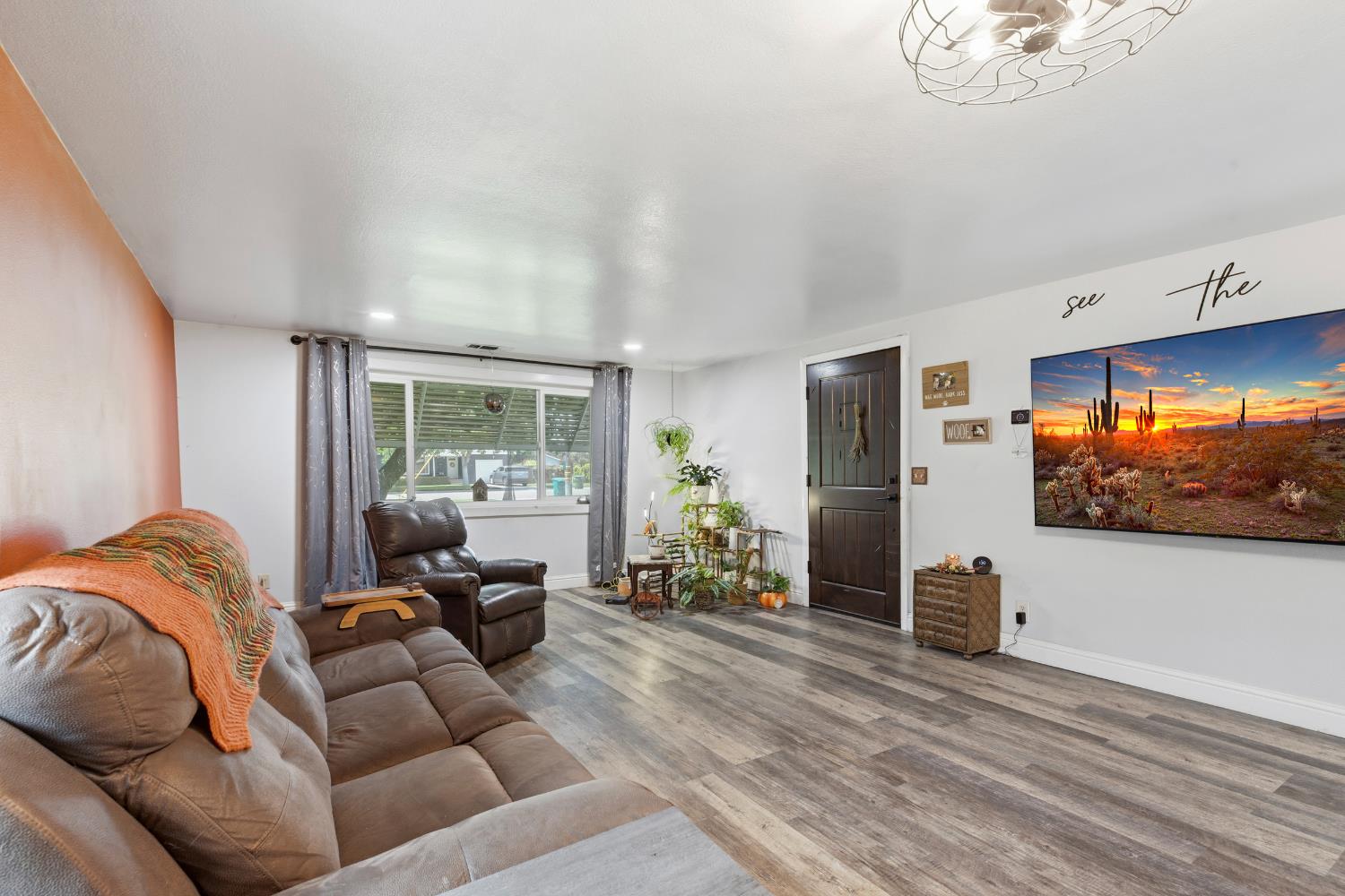 638 Orange Avenue Ripon, CA 95366 - Photo 7 of 30 a living room with furniture and a flat screen tv