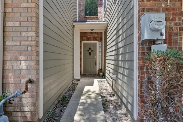 a view of a brick house with a large door