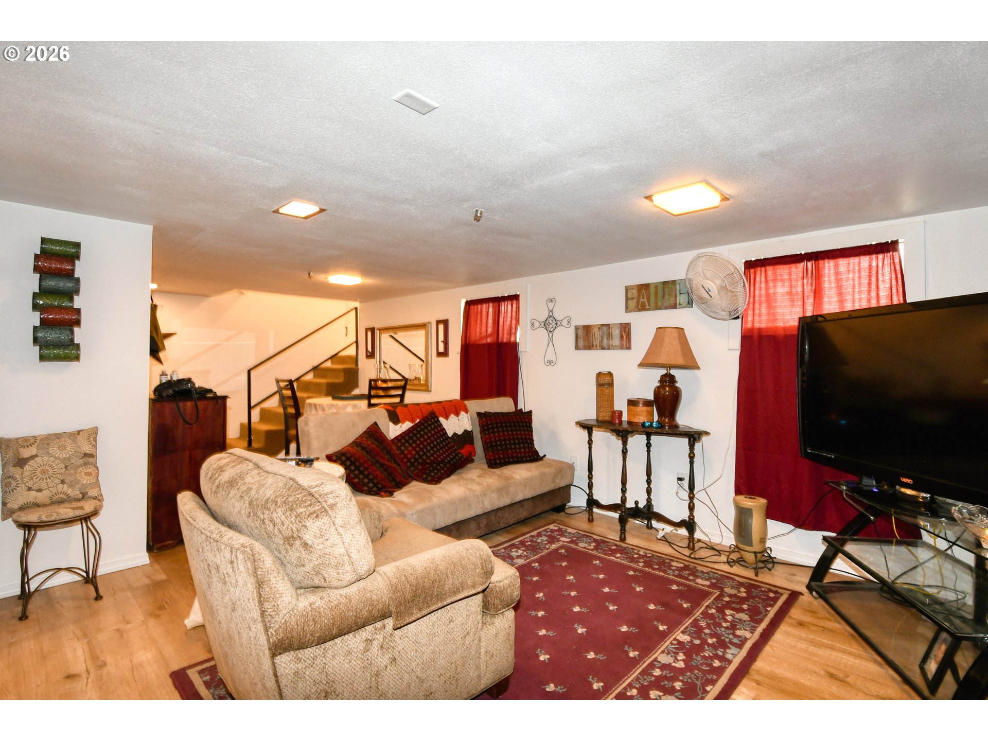 607 Southwest Court Avenue Pendleton, OR 97801 - Photo 30 of 48 a living room with furniture and a flat screen tv