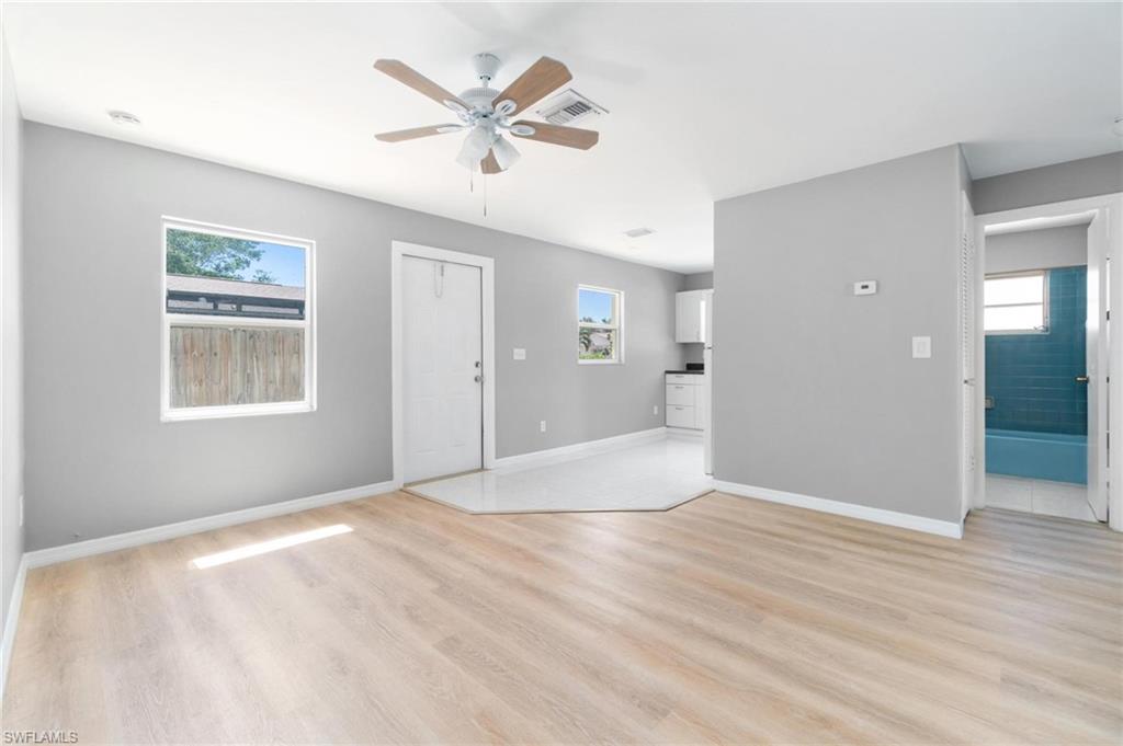 4337-4339 Mariner Road Bonita Springs, FL 34134 - Photo 11 of 29 wooden floor in an empty room with a window
