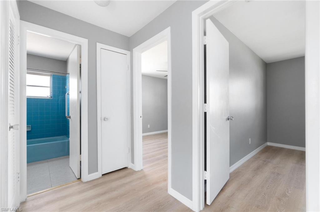 4337-4339 Mariner Road Bonita Springs, FL 34134 - Photo 17 of 29 a view of a hallway with wooden floor