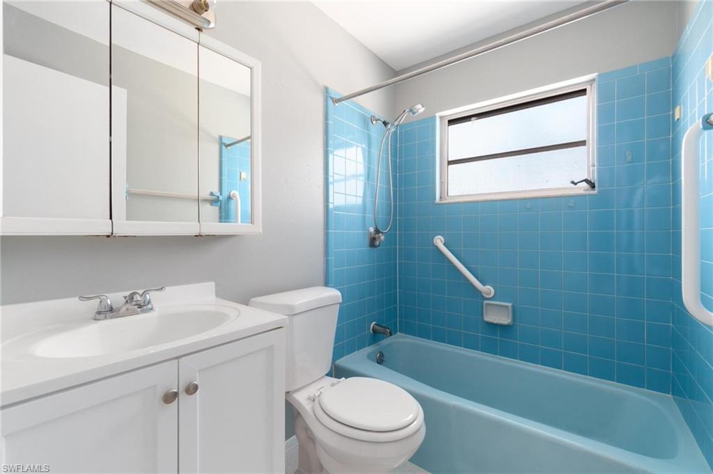 4337-4339 Mariner Road Bonita Springs, FL 34134 - Photo 20 of 29 a bathroom with a sink a toilet and shower