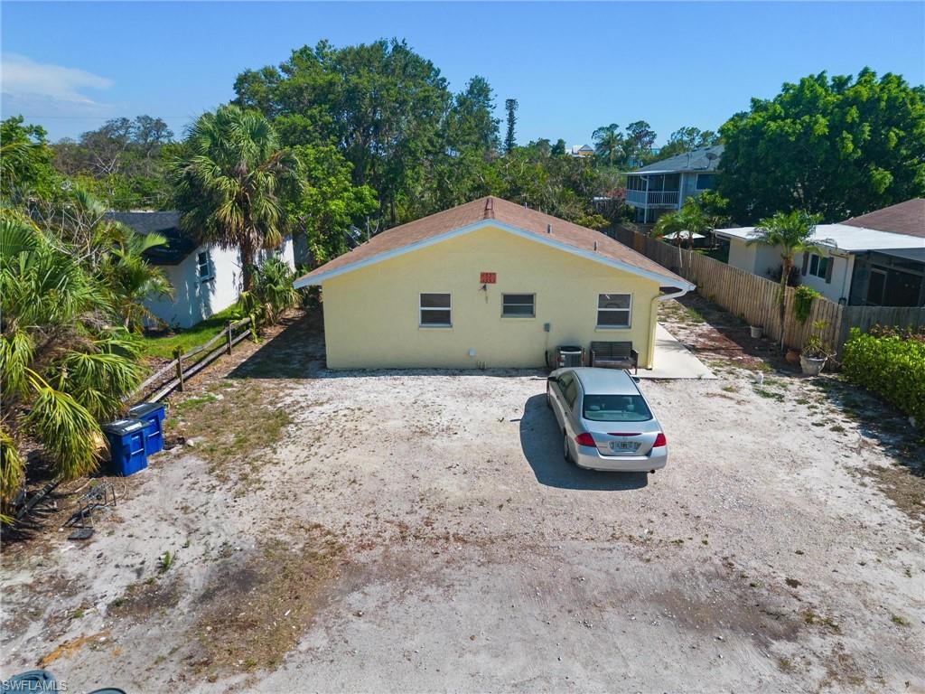 4337-4339 Mariner Road Bonita Springs, FL 34134 - Photo 2 of 29 a front view of a house with a yard