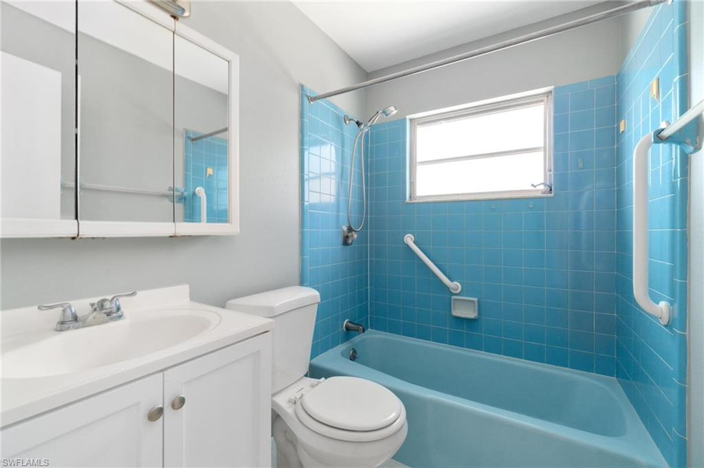 4337-4339 Mariner Road Bonita Springs, FL 34134 - Photo 21 of 29 a bathroom with a sink toilet and shower