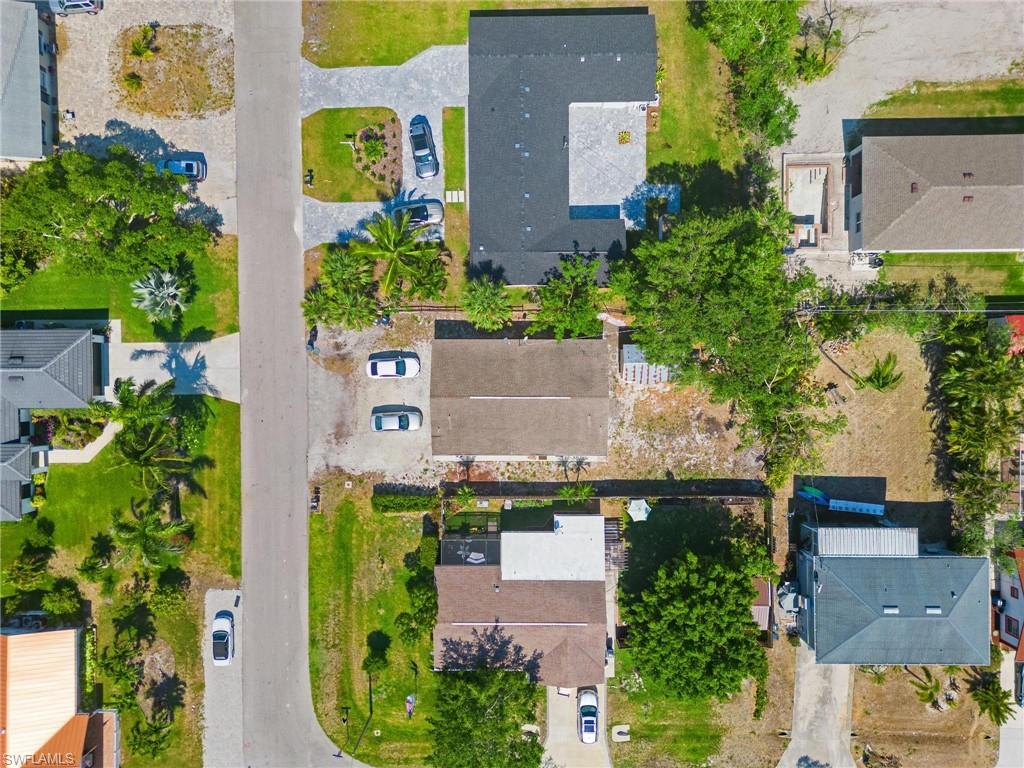 4337-4339 Mariner Road Bonita Springs, FL 34134 - Photo 5 of 29 an aerial view of house with a yard and swimming pool