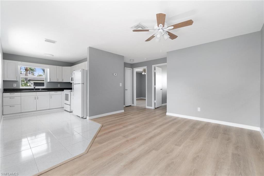 4337-4339 Mariner Road Bonita Springs, FL 34134 - Photo 10 of 29 a view of a kitchen with cabinet and a ceiling fan