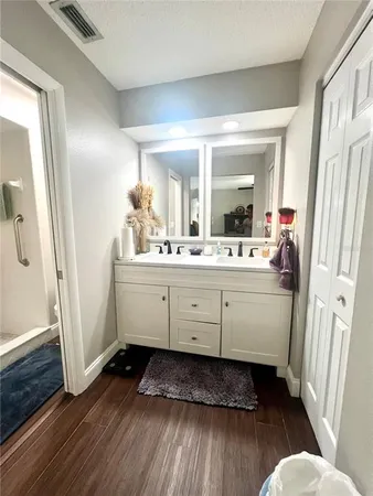 a bathroom with a sink mirror and window