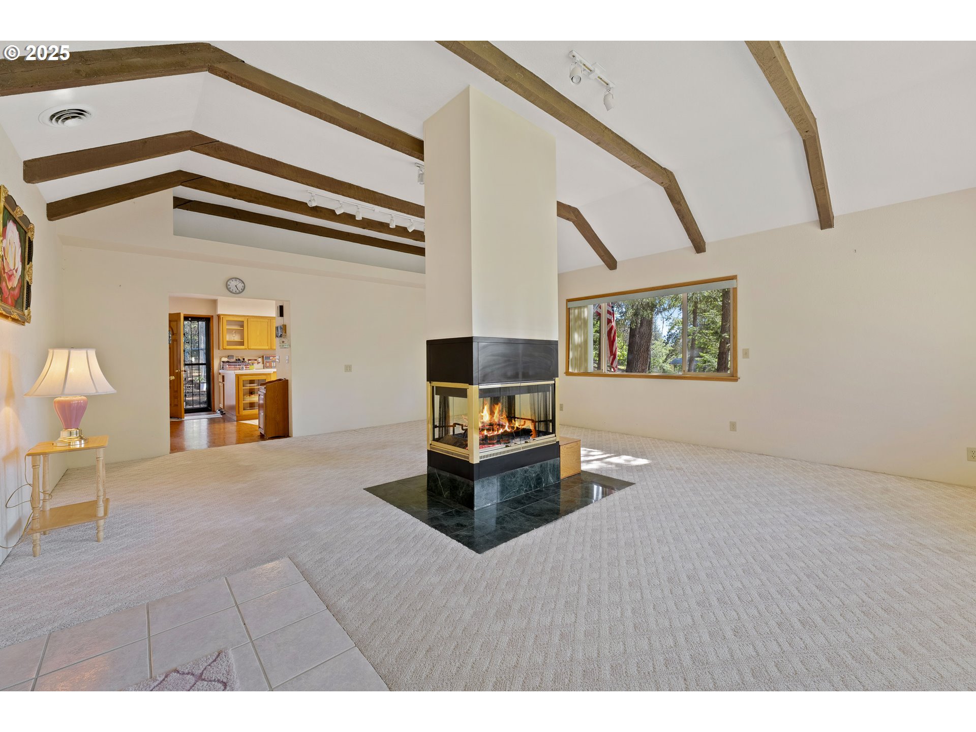 905 Summit Loop Grants Pass, OR 97527 - Photo 21 of 46 a living room with furniture and a flat screen tv