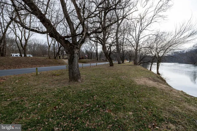 a view of lake with a yard