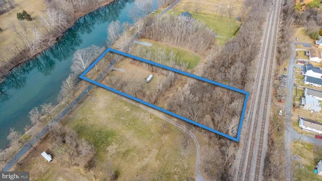 a view of a yard next to a lake view