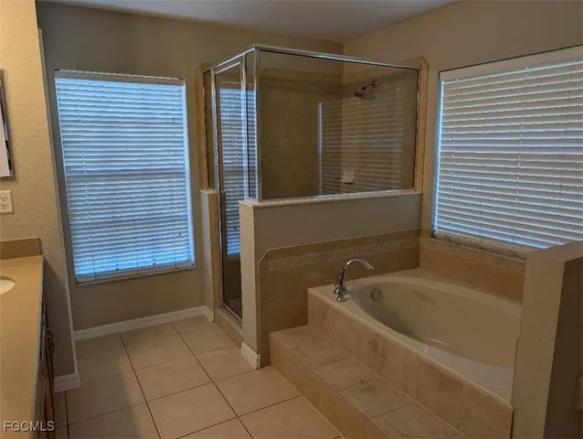 a bathroom with a bathtub and shower