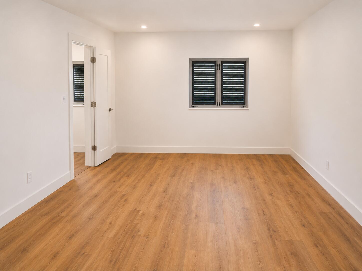 4815 Cleveland Street Hollywood, FL 33021 - Photo 14 of 31 an empty room with wooden floor and windows