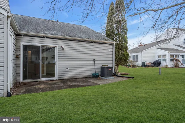 a view of a field with trees in the background