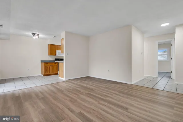 a view of kitchen with granite countertop window and sink