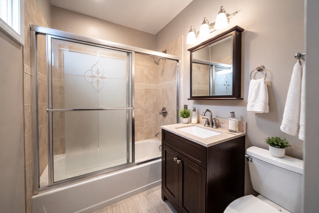 42 Morton Street Lawrence, MA 01841 - Photo 13 of 24 a bathroom with a sink and a mirror