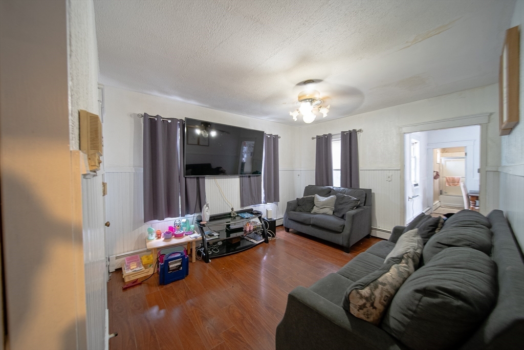 42 Morton Street Lawrence, MA 01841 - Photo 14 of 24 a living room with furniture and a flat screen tv