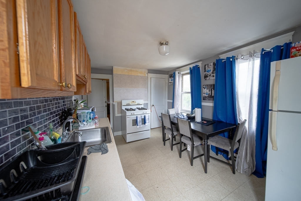42 Morton Street Lawrence, MA 01841 - Photo 18 of 24 a view of a dining room with furniture and window