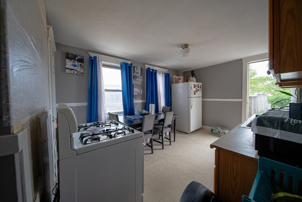 42 Morton Street Lawrence, MA 01841 - Photo 19 of 24 a room with furniture a window and gym equipment
