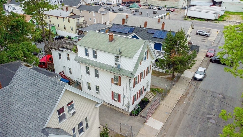 42 Morton Street Lawrence, MA 01841 - Photo 6 of 24 an aerial view of residential houses with outdoor space