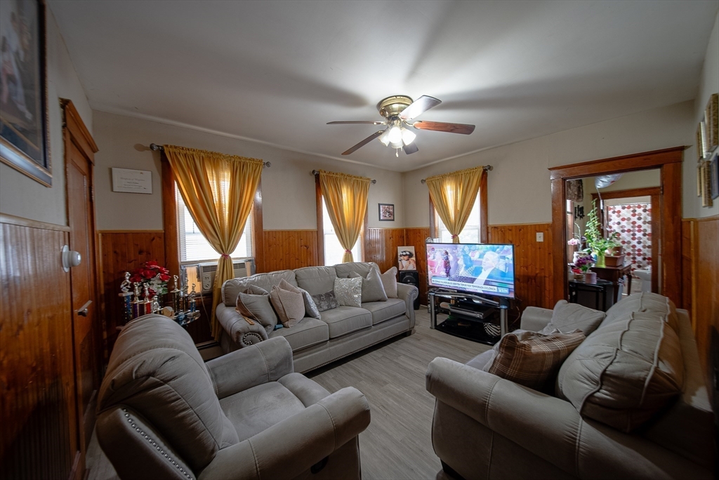 42 Morton Street Lawrence, MA 01841 - Photo 9 of 24 a living room with furniture ceiling fan and a window