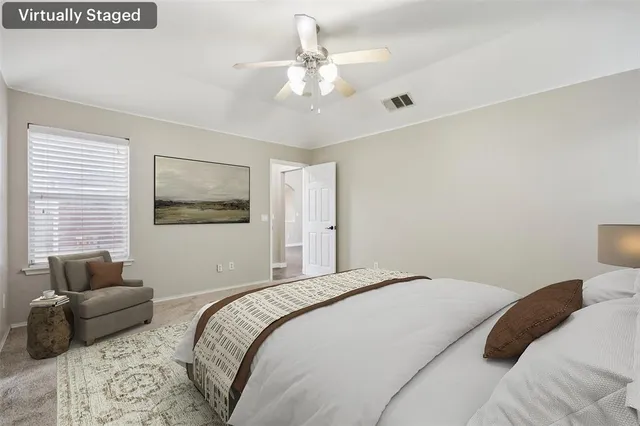 a bathroom with a tub a sink and mirror