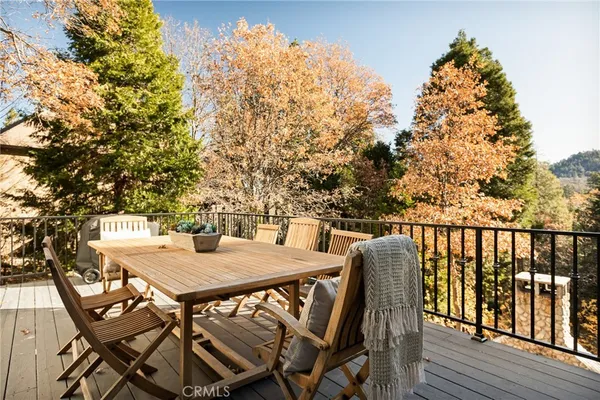 a view of a patio with iron fence