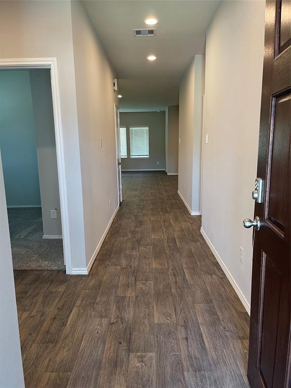 13872 Rock Island Trail Conroe, TX 77384 - Photo 17 of 32 a view of a hallway with wooden floor