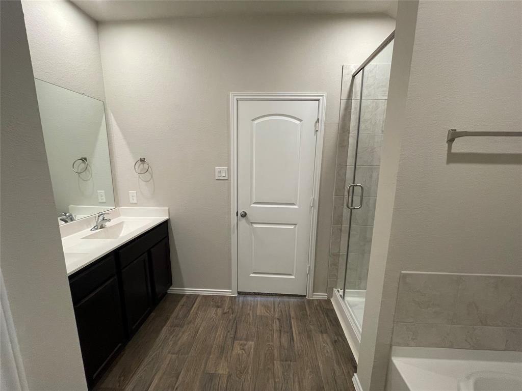 13872 Rock Island Trail Conroe, TX 77384 - Photo 25 of 32 a bathroom with a sink and mirror
