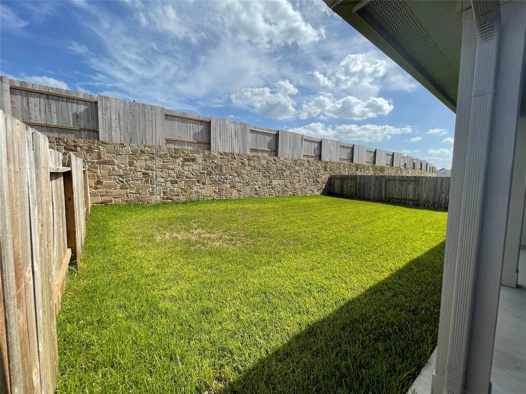 13872 Rock Island Trail Conroe, TX 77384 - Photo 28 of 32 a view of a living room and a yard