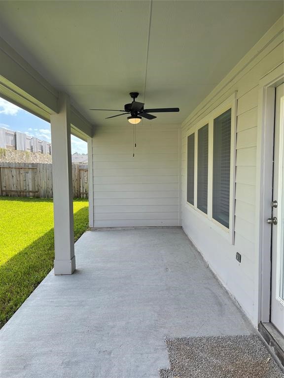 13872 Rock Island Trail Conroe, TX 77384 - Photo 29 of 32 a view of a room with a floor to ceiling window and an outdoor view