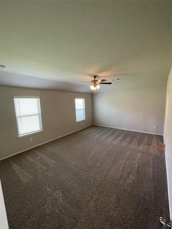 13872 Rock Island Trail Conroe, TX 77384 - Photo 10 of 32 an empty room with a empty space and windows