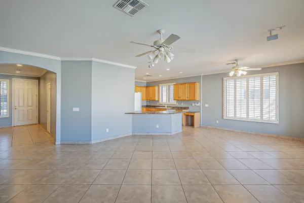 a view of kitchen with windows and ceiling fan