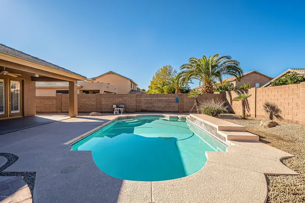 a view of swimming pool with a yard